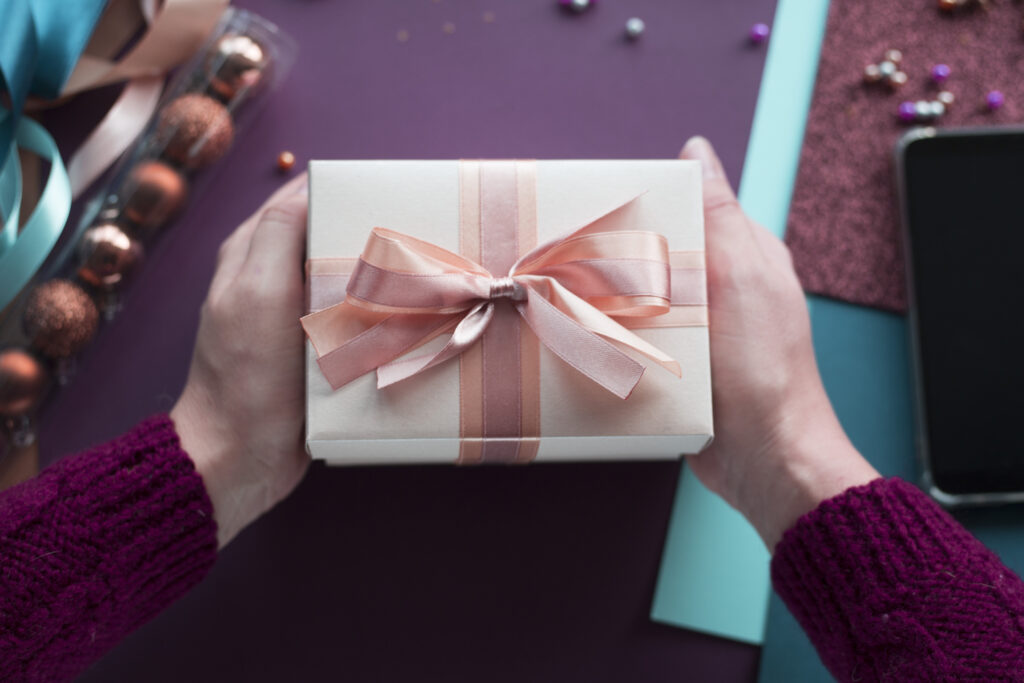 Hands Holding Present For Christmas