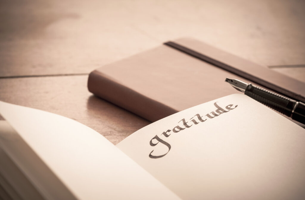 Notebook On Wooden Table Gratitude Journal