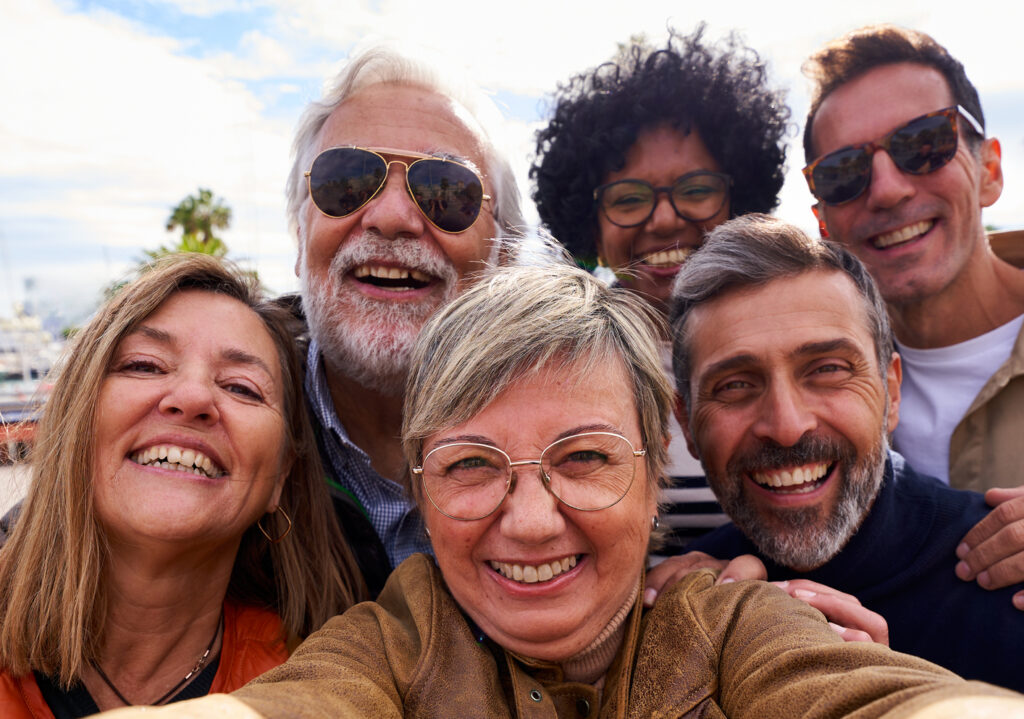 Multiracial Group Of Mature People Taking A Selfie Together During Family And Friends Trip.