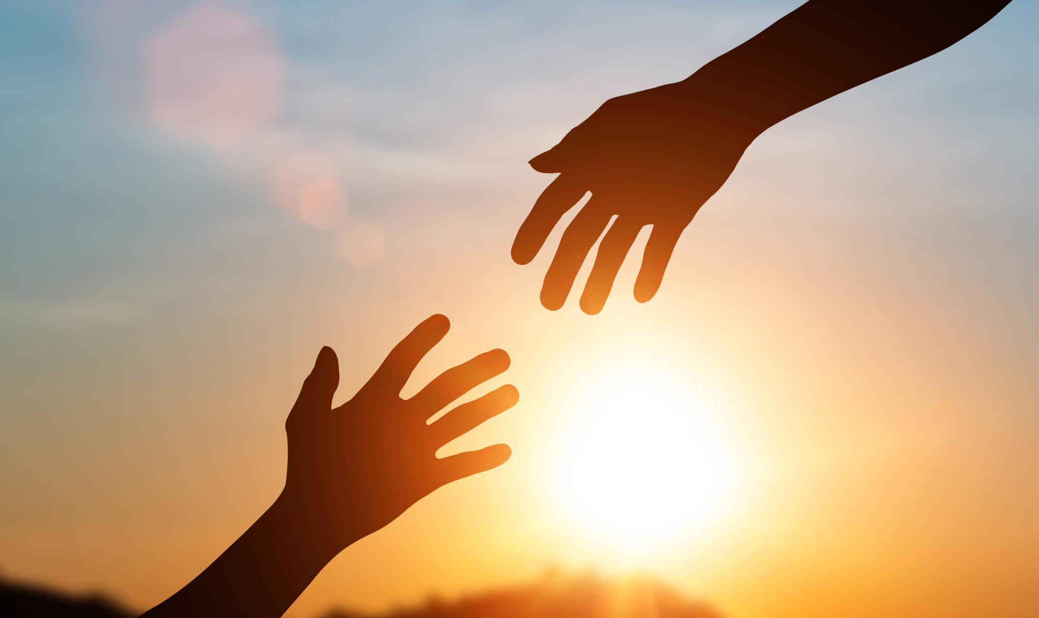 Silhouette Of Helping Hand And Develop A Friendship. International Day Of Peace Concept. Helping Hand To A Friend