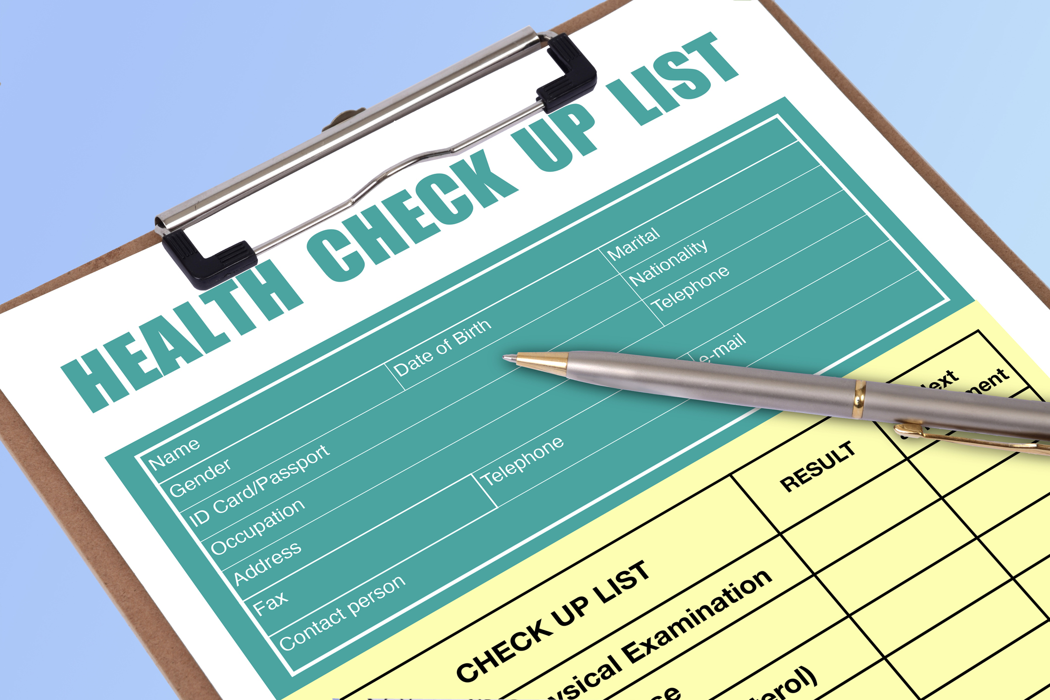 A Pen On Blank Health Check List Form On Clipboard.